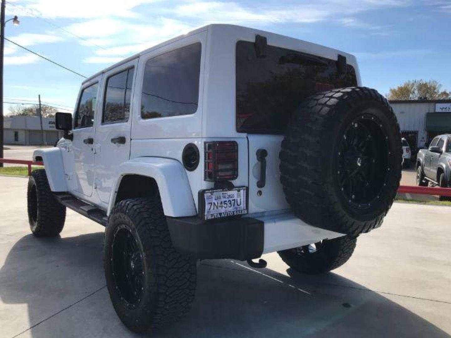 2016 Bright White Clear Coat /Black, leather Jeep Wrangler Unlimited Sahara 4WD (1C4BJWEG3GL) with an 3.6L V6 DOHC 24V FFV engine, located at 900 South McDonald Street, McKinney, TX, 75069, (972) 529-2992, 33.189335, -96.613403 - Photo#5