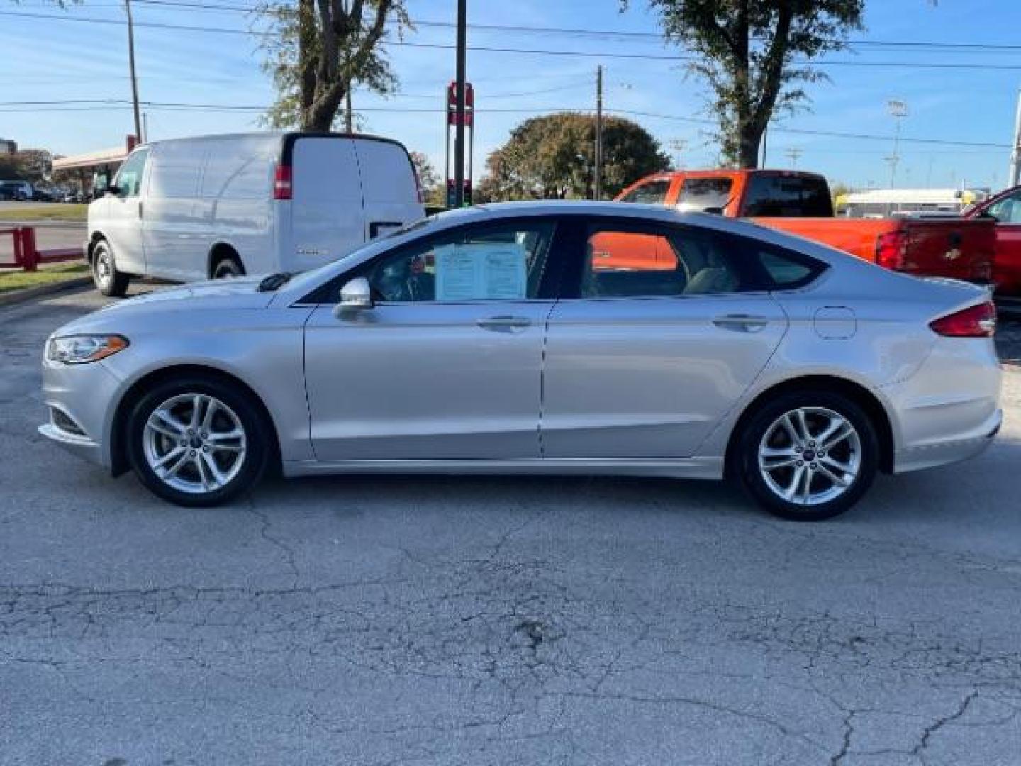 2018 Ingot Silver Metalli /Medium Light Stone, Ford Fusion SE (3FA6P0H79JR) with an 2.5L L4 DOHC 16V engine, 6-Speed Automatic transmission, located at 900 South McDonald Street, McKinney, TX, 75069, (972) 529-2992, 33.189335, -96.613403 - Photo#1