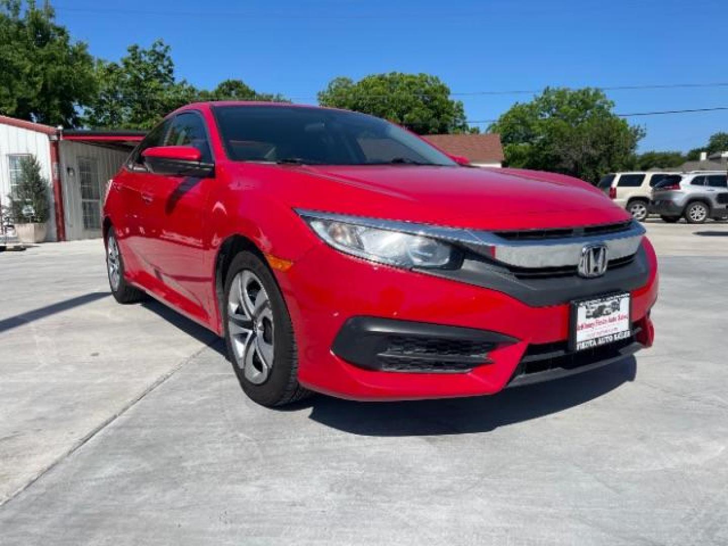 2017 Rallye Red /Black, cloth Honda Civic LX Sedan CVT (2HGFC2F57HH) with an 2.0L L4 DOHC 16V engine, Continuously Variable Transmission transmission, located at 900 South McDonald Street, McKinney, TX, 75069, (972) 529-2992, 33.189335, -96.613403 - Photo#0