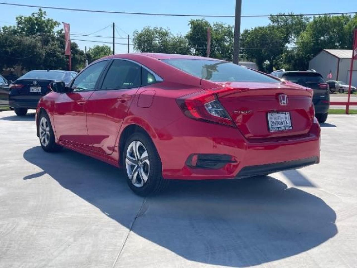 2017 Rallye Red /Black, cloth Honda Civic LX Sedan CVT (2HGFC2F57HH) with an 2.0L L4 DOHC 16V engine, Continuously Variable Transmission transmission, located at 900 South McDonald Street, McKinney, TX, 75069, (972) 529-2992, 33.189335, -96.613403 - Photo#2