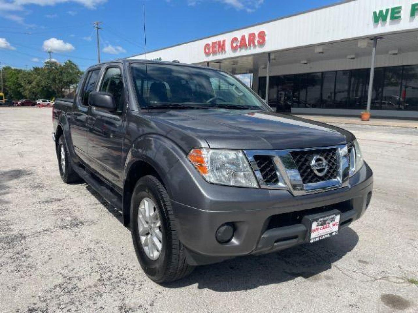 2016 Gun Metallic /Black cloth Nissan Frontier SL Crew Cab 5AT 2WD (1N6AD0ER2GN) with an 4.0L V6 DOHC 24V engine, 5-Speed Automatic transmission, located at 900 South McDonald Street, McKinney, TX, 75069, (972) 529-2992, 33.189335, -96.613403 - Photo#0