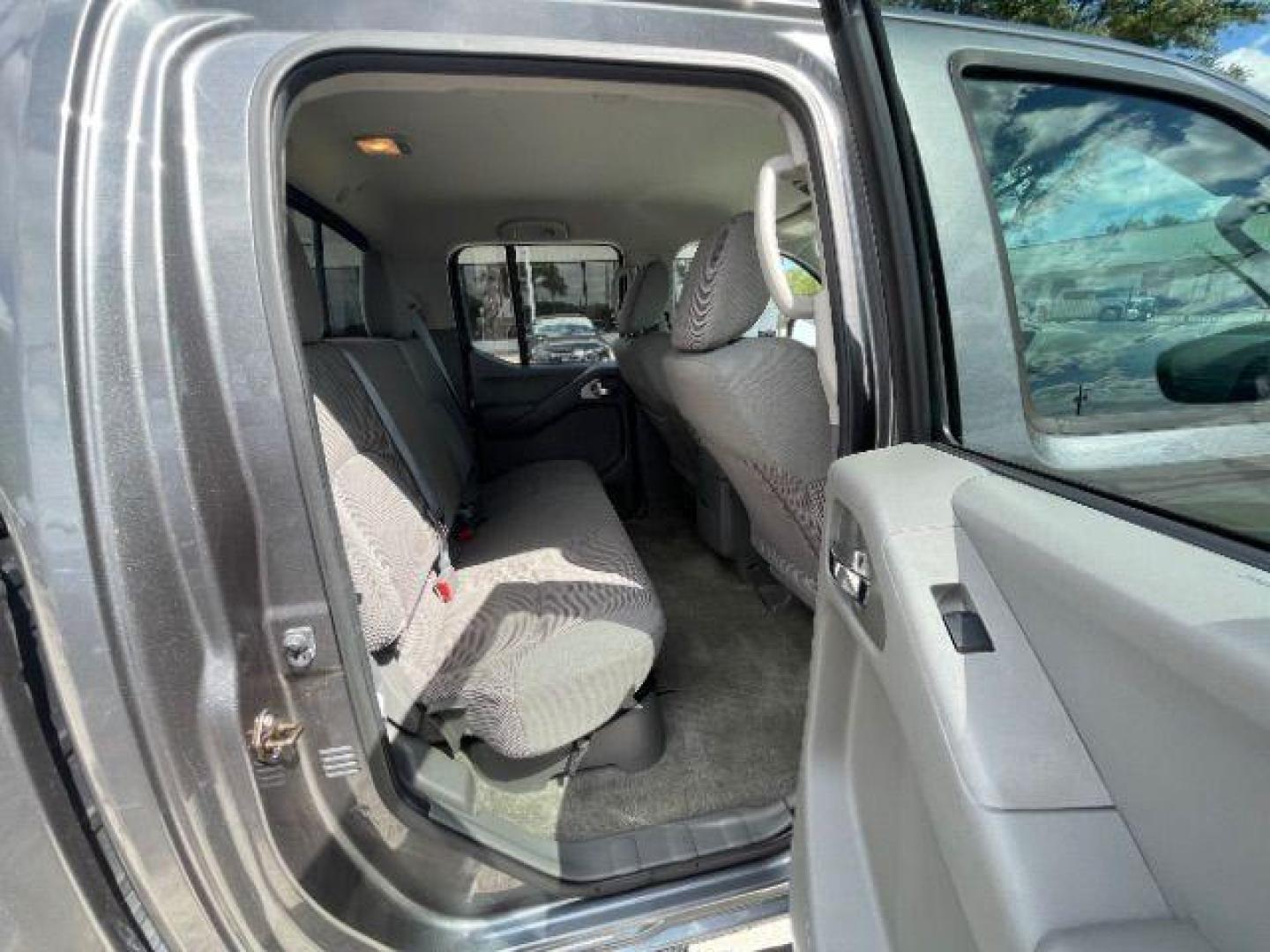 2016 Gun Metallic /Black cloth Nissan Frontier SL Crew Cab 5AT 2WD (1N6AD0ER2GN) with an 4.0L V6 DOHC 24V engine, 5-Speed Automatic transmission, located at 900 South McDonald Street, McKinney, TX, 75069, (972) 529-2992, 33.189335, -96.613403 - Photo#12