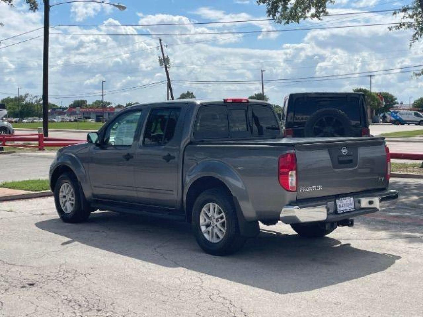 2016 Gun Metallic /Black cloth Nissan Frontier SL Crew Cab 5AT 2WD (1N6AD0ER2GN) with an 4.0L V6 DOHC 24V engine, 5-Speed Automatic transmission, located at 900 South McDonald Street, McKinney, TX, 75069, (972) 529-2992, 33.189335, -96.613403 - Photo#2