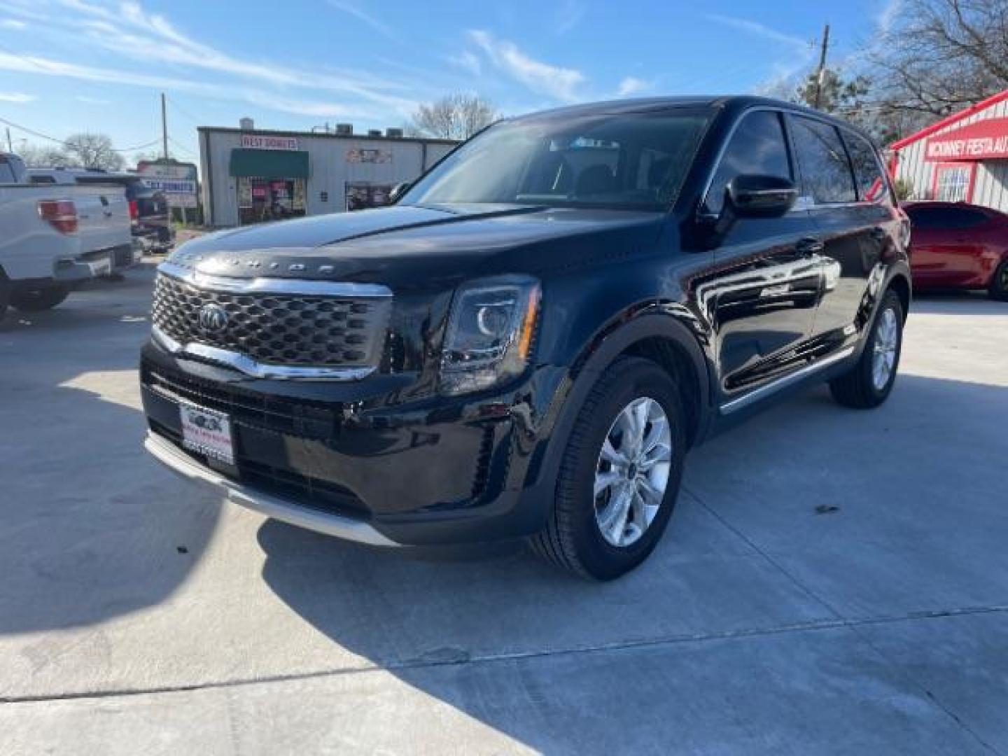 2020 Ebony Black /Black SOFINO, leatherette Kia Telluride LX (5XYP24HC6LG) with an 3.8L V6 DOHC 24V engine, 8-Speed Automatic transmission, located at 900 South McDonald Street, McKinney, TX, 75069, (972) 529-2992, 33.189335, -96.613403 - Photo#2