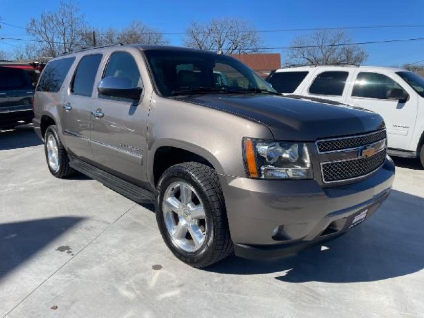 2013 Mocha Steel Metallic /Light Cashmere/Dark Cashmere Leather Interior Chevrolet Suburban LTZ 1500 2WD (1GNSCKE03DR) with an 5.3L V8 OHV 16V FFV engine, 6-Speed Automatic transmission, located at 900 South McDonald Street, McKinney, TX, 75069, (972) 529-2992, 33.189335, -96.613403 - Photo#0